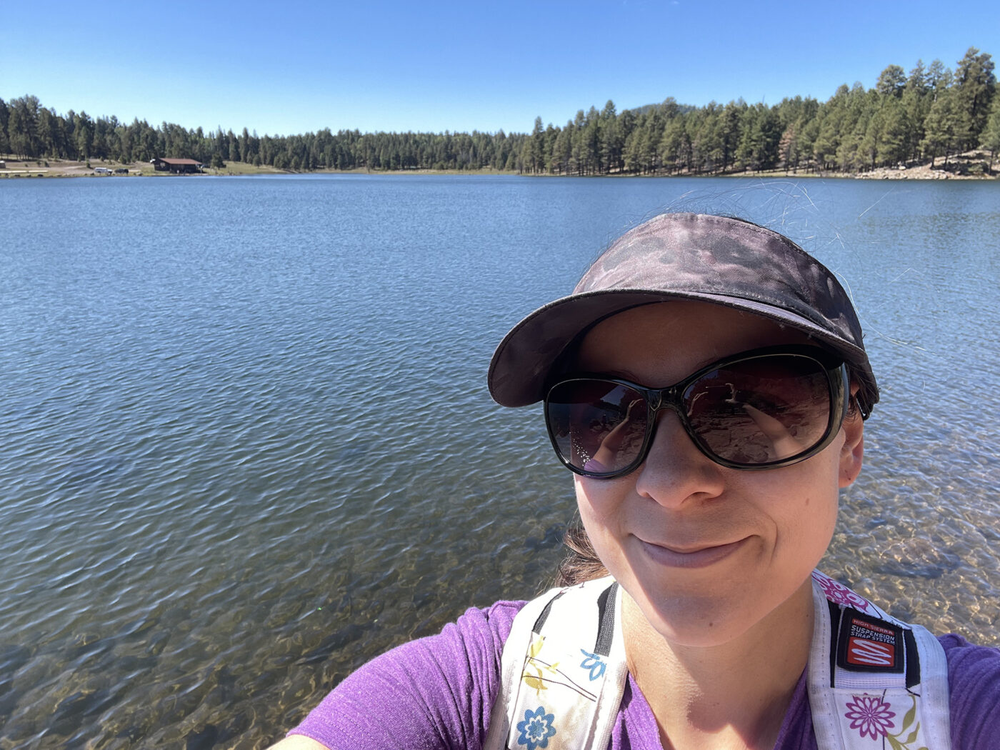 Me and a gorgeous blue lake and green pine trees.