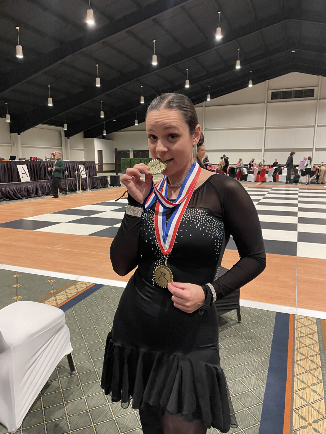 Me with my medals wearing my black latin dress.