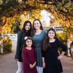 My family under a beautiful arch of vines.
