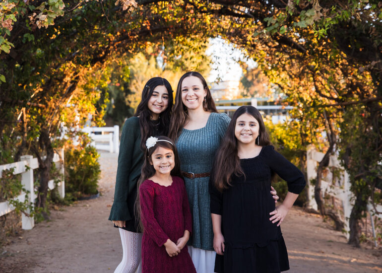 My family under a beautiful arch of vines.