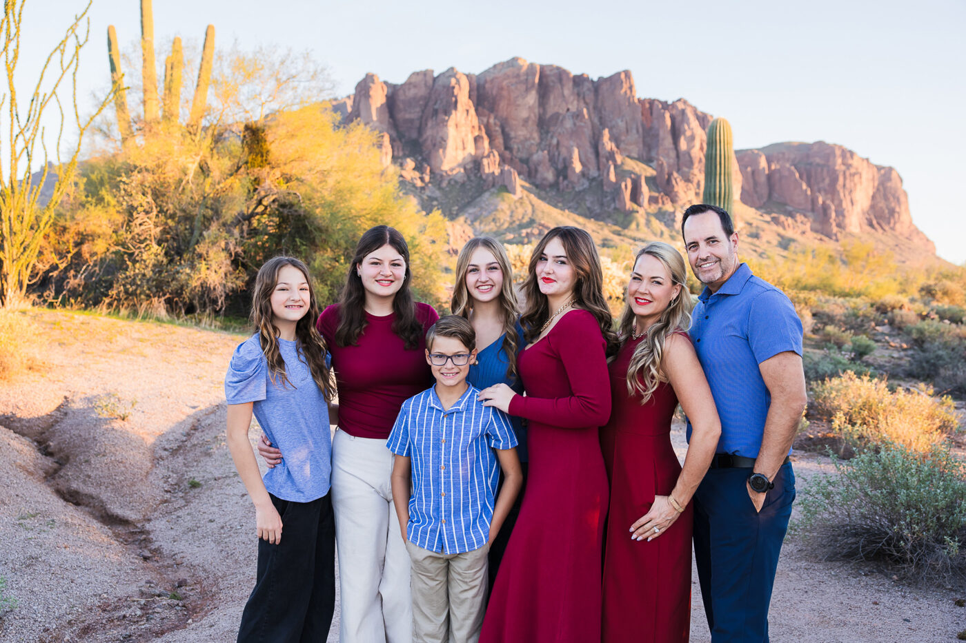 Family with 5 children in from of Superstition Mountain at sunset.