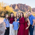 Family with 5 children in from of Superstition Mountain at sunset.