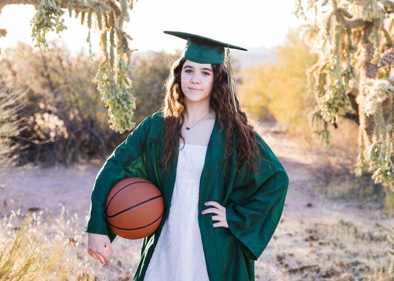 Basha high senior in the desert holding a basketball