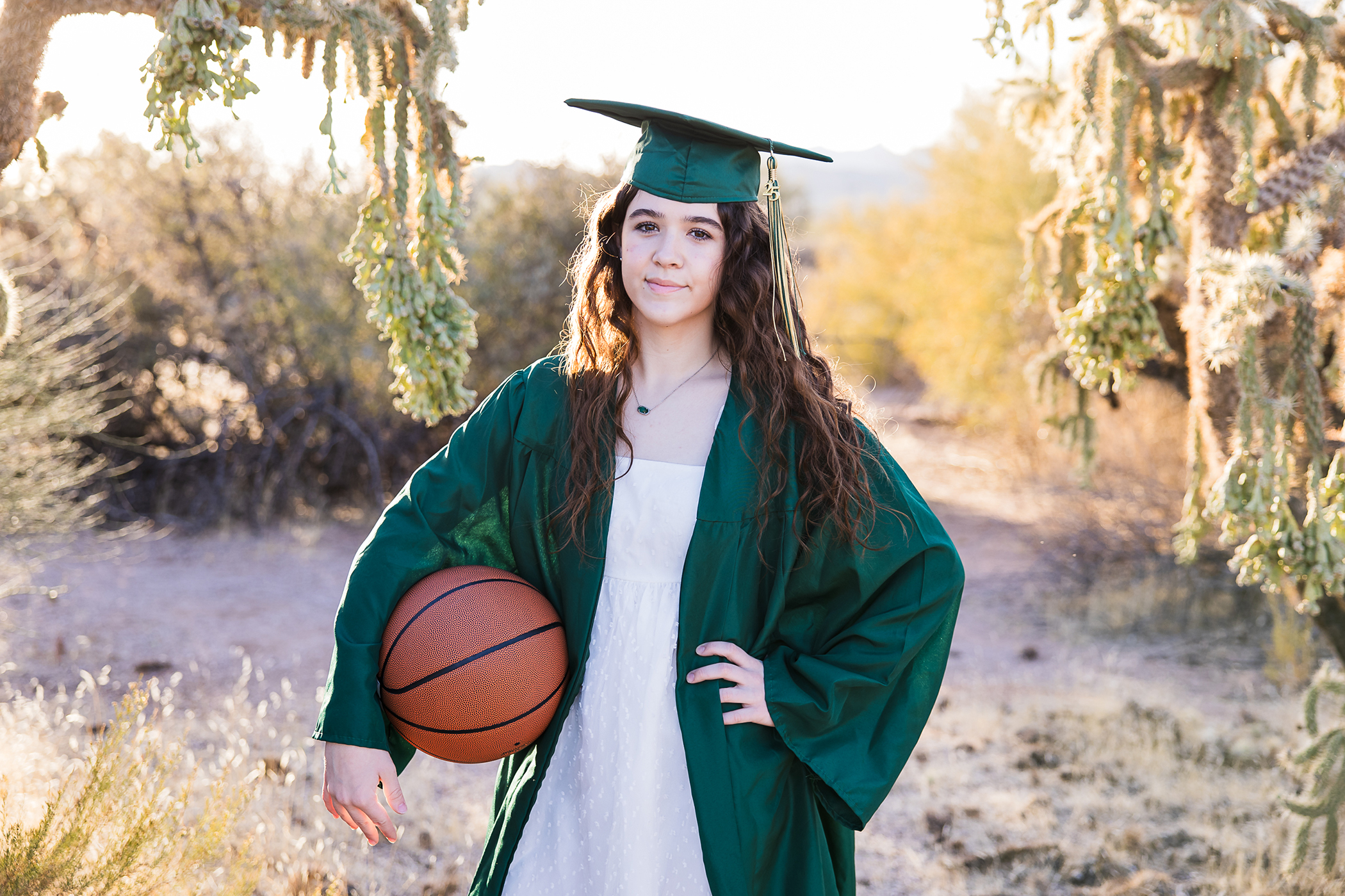 Basha high senior in the desert holding a basketball